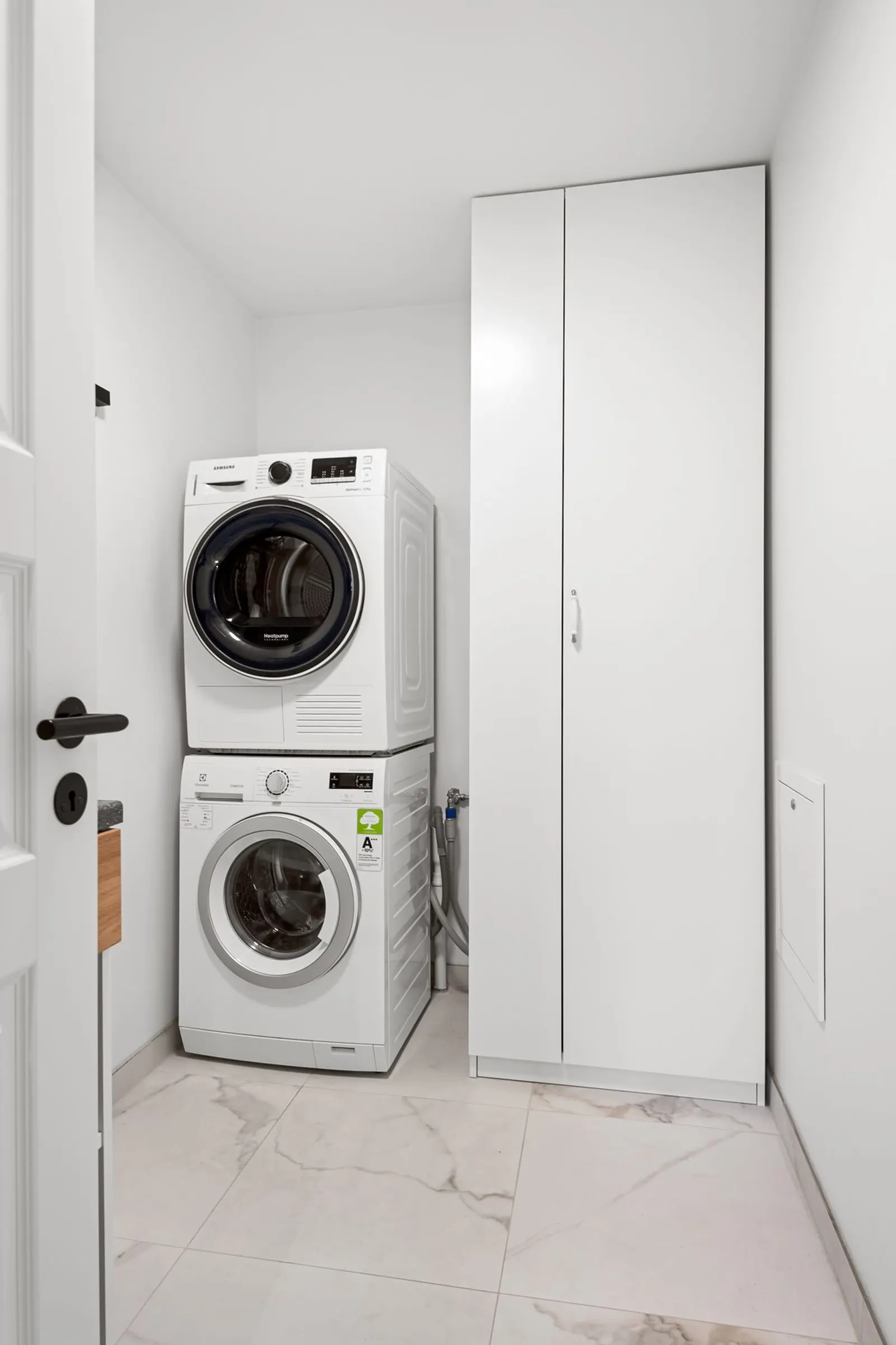 Front-load washing machine in a Portland home laundry room
